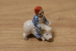 A scarce Wade whimsie, depicting tiny elf riding a pig.