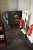 A contemporary rectangular mirror with bevelled edge glass frame, measuring 72cm x 118cm