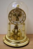 A 20th Century Bentima Anniversary clock, the dial having applied gilt metal Arabic numerals above a