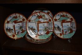 Six 19th/20th Century Japanese Kutani dishes, decorated with geisha and heightened in gilding,