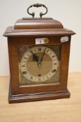 A 20th Century mantel clock by Perivale Clock Company, the walnut three glass sided case enclosing