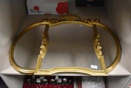 Three modern gilt framed mirrors, two matching oval shape 52cm x 38cm and an ornate floral