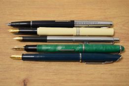 Five pens including two Osmiroid an Italic and a 65 and two Platinum fountain pens and a Papermate