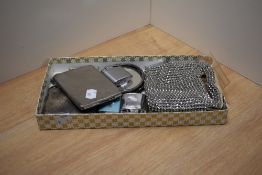 A nice little assortment of items including two cigarette cases, four vintage cigarette lighters and
