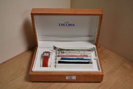 A Delma wristwatch having a rectangular mother-of-pearl dial with Roman numeral marker at 12 and