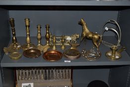 An assorted collection of brass and copperware, to include candlesticks, miniature anvil, and a