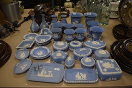 A large assortment of Wedgewood Jasperware including trinket boxes, urns and vases.