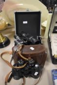 A pair of Vanguard ZR-82450 binoculars housed in a hard case sold along with a pair of Ross of