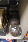 Four Lignum Vitae lawn bowls.