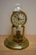 A late 19th/early 20th Century 400 day anniversary clock by Gustav Becker, having an enamelled