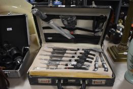 A Kronenberg S.G. unused deluxe knife and kitchen utensil set in two layer fitted case, containing