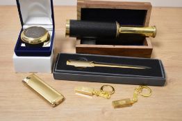 A 20th Century miniature threedraw telescope in nautical inlaid box, a polished brass letter opener,
