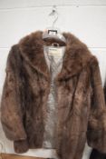 A vintage ladies brown fur jacket 44' approx.