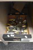 A boxed of assorted cutlery and flatware including cake knifes, serving spoons etc.