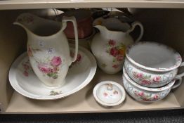 A toilet jug and bowl together with four chamber pots and a soap dish mostly having floral