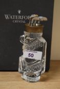 A boxed Waterford Crystal glass golf bag ornament, measuring 14cm high