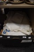 A large selection of vintage tablecloths, tray cloths and napkins. Some with lace work and