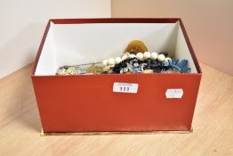 A collection of costume jewellery including beaded necklaces, loose beads, cufflinks, a small silver