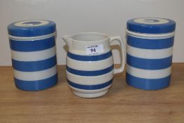 A pair of mid-20th Century T.G. Green & Co Cornish ware lidded storage jars, measuring 14cm high,