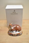 A Royal Crown Derby bone china Fawn collectors guild paperweight, decorated in a stylised Imari