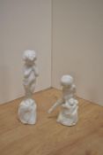 Two Royal Doulton blanc-de-chine figurines, A Saucy Nymph HN1539 and Happy Joy Baby Boy HN1541, both