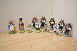 A group of eleven collectible Wade porcelain figures, comprising five 'Newark 1998' travelling