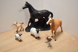 A Beswick pottery Ayshire calf study, number 1249b, designed in Arthur Gredington in brown and white