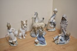 A group of seven Lladro porcelain style studies, figurines and groups, six being Nao porcelain,