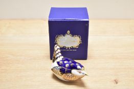 A Royal Crown Derby bone china wren paperweight, decorated in a stylised Imari palette with silver