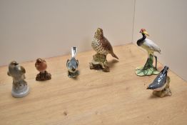 A group of four Beswick pottery ornithological studies, comprising Song Thrush number 2308, Robin