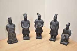 A group of five cast reproduction Chinese terracotta army warrior figures, the tallest 23cm, one