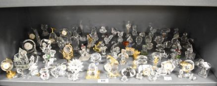 A large quantity of Swarovski style crystal ornaments, various to include state carriage, globe