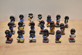 A collection of nineteen Robertson's Jam advertising figures, mainly band members but including