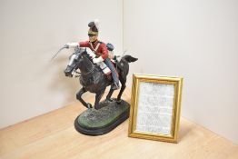 A cast-resin British 'Waterloo era' Household Cavelry trooper, modelled charging on horseback with