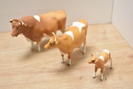 A Beswick Pottery Guernsey cattle family, comprising bull, Champion Sabrina's Sir Richmond 14th,