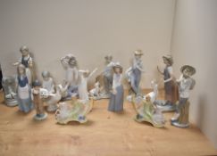A collection of eleven Nao porclelain figures and figurines, typically in the Lladro porcelain