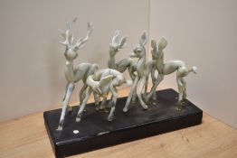An unusual mid century mottled glass animal group, consisting of a stag and four does, each in