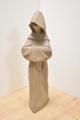 A Lladro porcelain Franciscan monk figure, modelled standing in buff coloured habit with hood up and