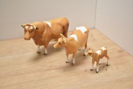A Beswick Pottery Guernsey cattle family, comprising Bull Champion Sabrina's Sir Richmond 14th,