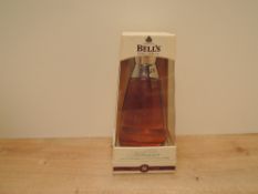 A bottle of 2000 Millennium Bell's Extra Special Blended Whisky, aged 8 years, 40% vol, 70cl in