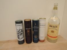 A Empty bottle of Bell's Old Scotch Whisky, 4.5 Litre along with three empty Whisky Tubes,