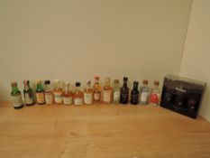 A collection of Whisky, Gin and Port Miniatures, Glenfiddich three bottle 12, 15 & 18 year set, Tal