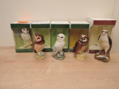 Five Royal Doulton Scottish Owls and Birds of Prey Decanters, four containing White & Mackay Blended