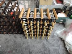 A modern light wood and metal wine rack, capable of holding 30 bottles