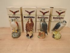 A set of Four Beswick/Royal Doulton Golden Beneagles Scotch Blended Whisky Decanters, all sealed and