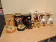 Six Wade Royal Decanters containing Bells Old Scotch Whisky, Christmas 1990, Christmas 1993, 1986