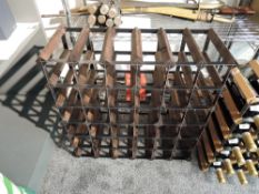 A modern dark wood and metal wine rack, capable of holding 42 bottles