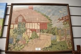 A 20th Century needlework embroidery of a cottage.