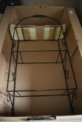 A vintage wire wall shelf having three glass shelves, four etching prints mainly of Rugby School and