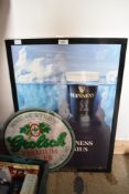 Two plastic advertising signs for Grolsch lager and Guinness, the largest measures 45cm x 65cm
